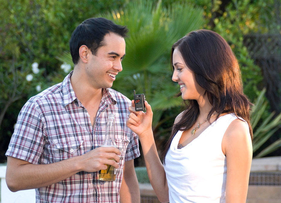 Man and woman with BACtrack Keychain